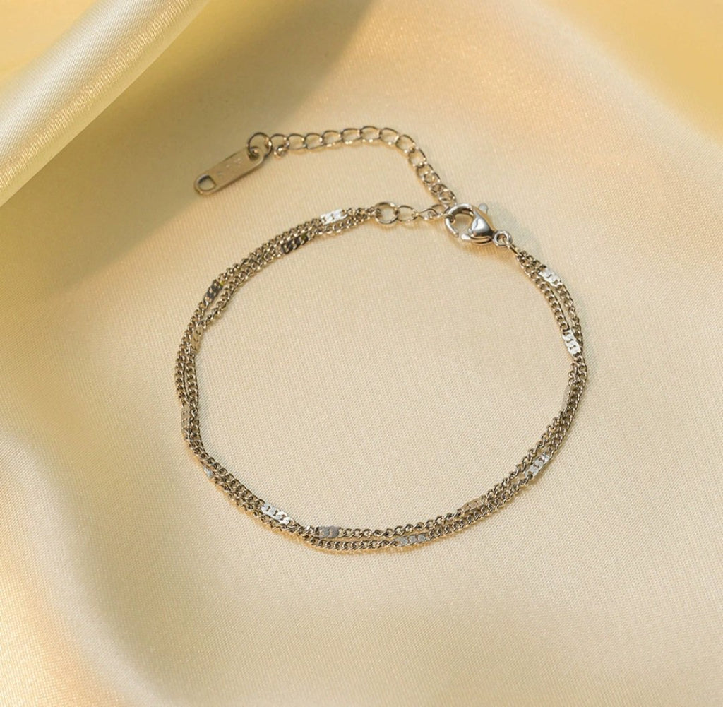 Simple silver Zainy jewelry piece by Glitze Accessories featuring a sleek, minimalist design in shiny silver finish.