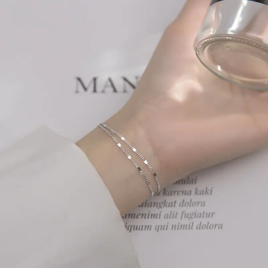 Simple silver jewelry piece from Glitze Accessories' Zainy collection, featuring sleek, modern design with polished silver finish.