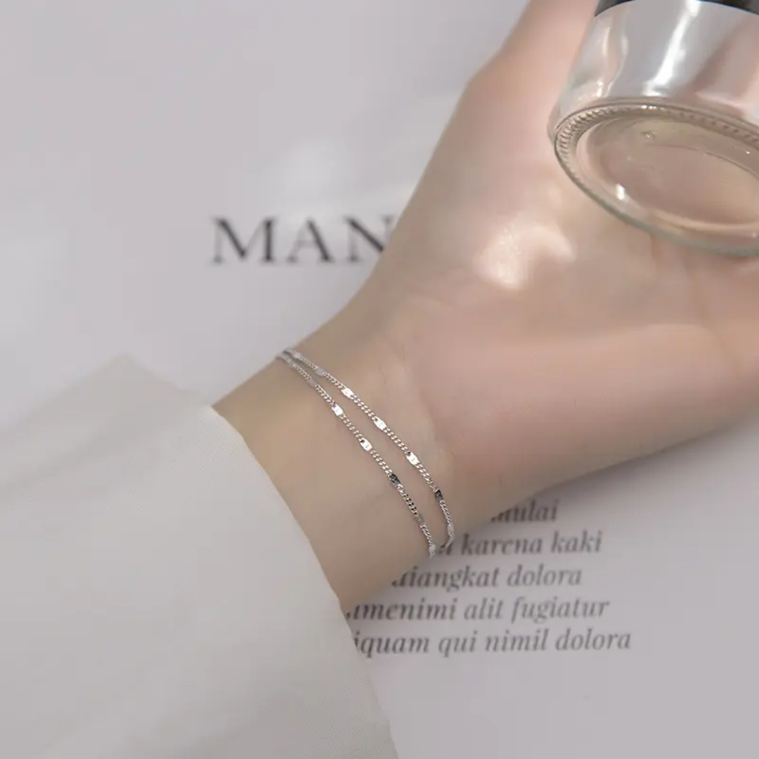 Simple silver jewelry piece from Glitze Accessories' Zainy collection, featuring sleek, modern design with polished silver finish.