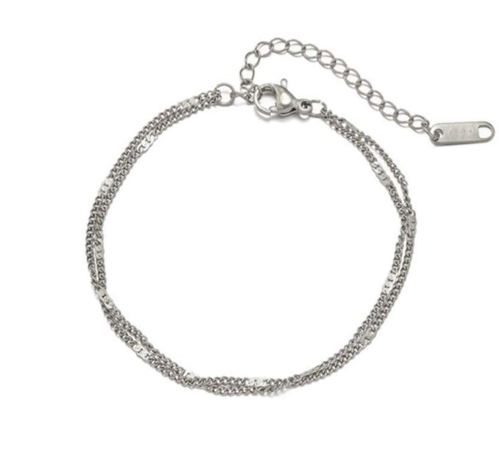 Simple silver jewelry piece by Glitze Accessories, showcasing a sleek and minimalist design with a polished finish.