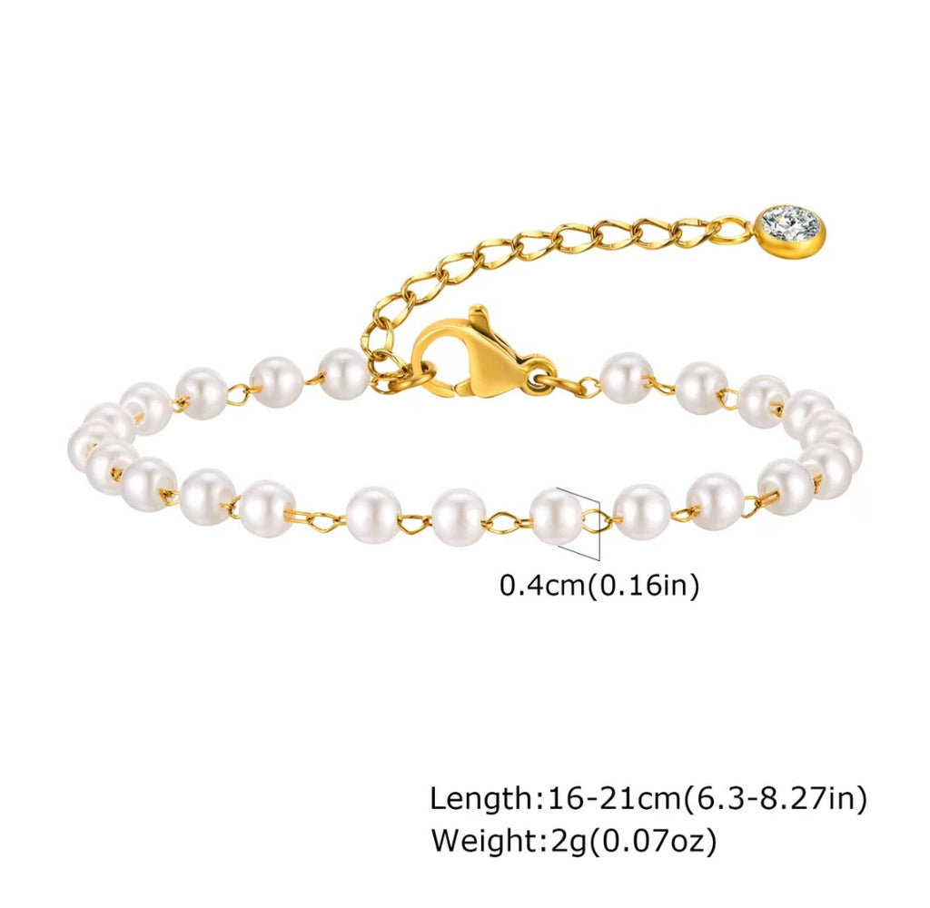 Elegant pearl bracelet by Glitze Accessories featuring white pearls and silver accents on a delicate jewelry chain.