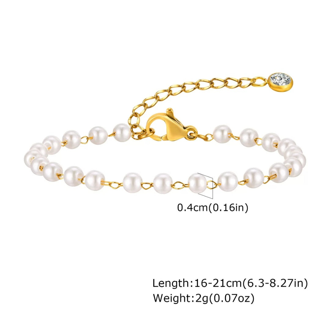Elegant pearl bracelet by Glitze Accessories featuring white pearls and silver accents on a delicate jewelry chain.