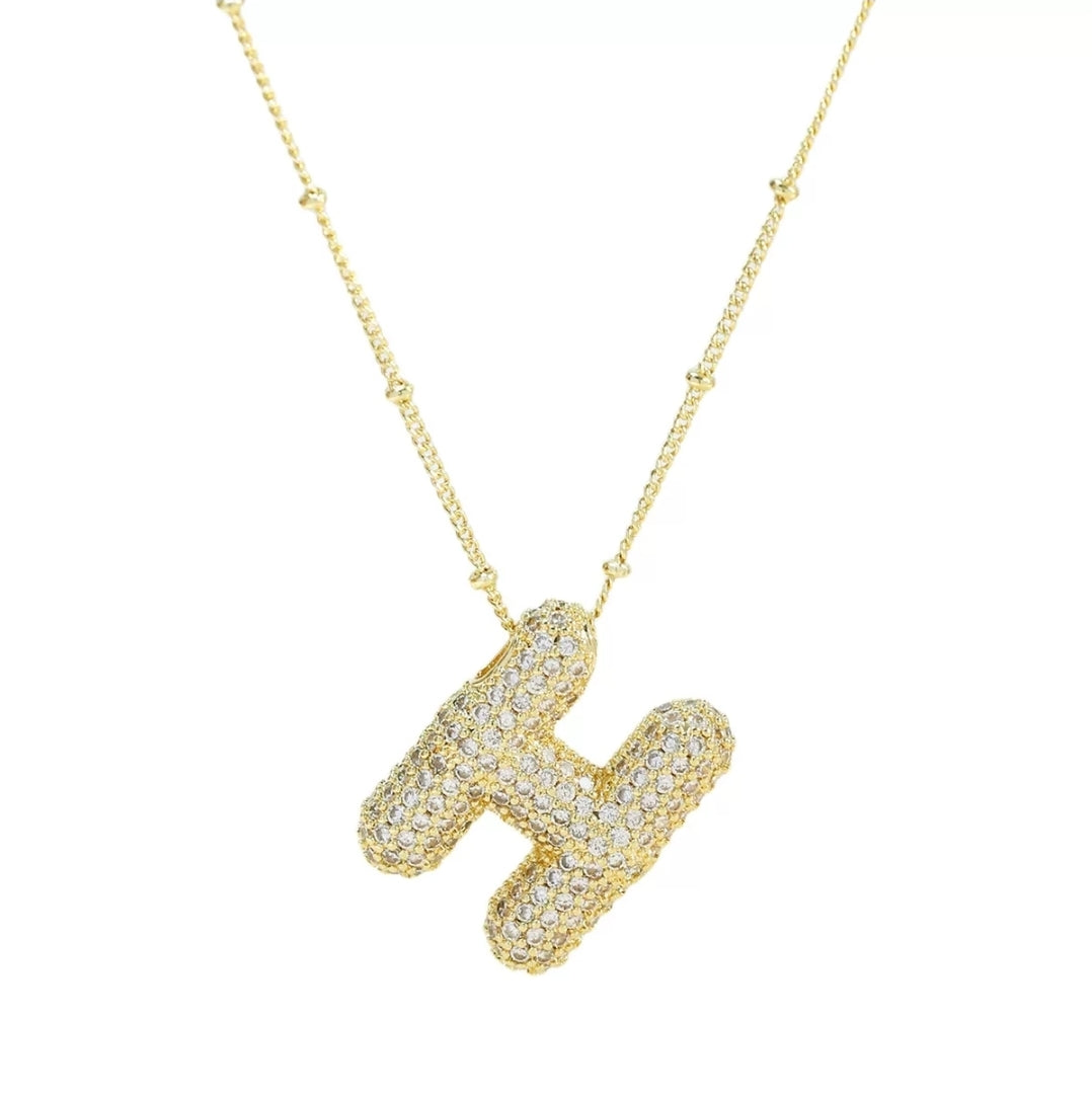 Simple initial necklace with the letter H from Glitze Accessories featuring a delicate chain and minimalist design.