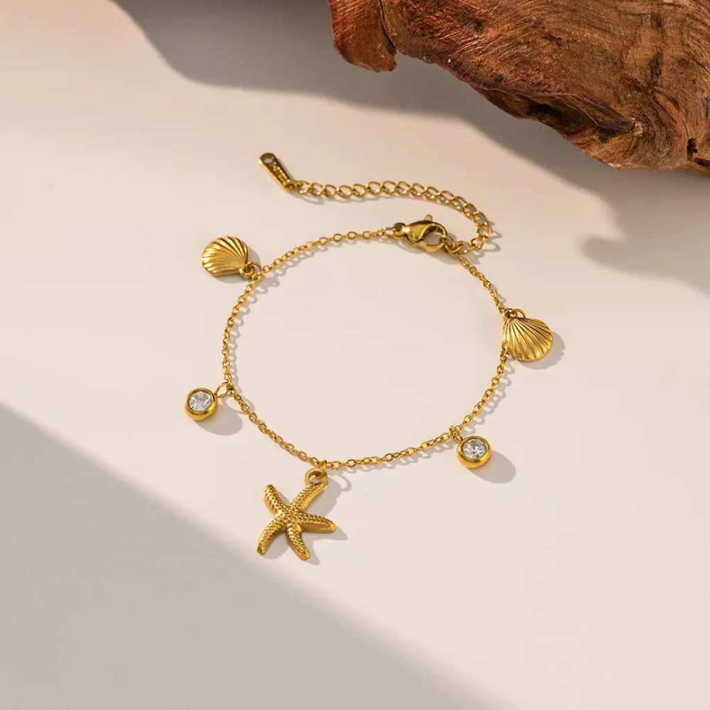 Glitze Accessories Miami jewelry set featuring layered necklaces and matching earrings in gold-tone finish.