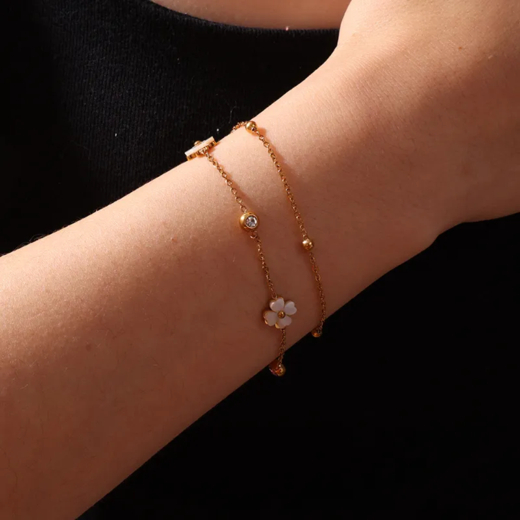 Simple Lily Bracelet by Glitze Accessories featuring delicate floral design and silver-tone chain on a neutral background.
